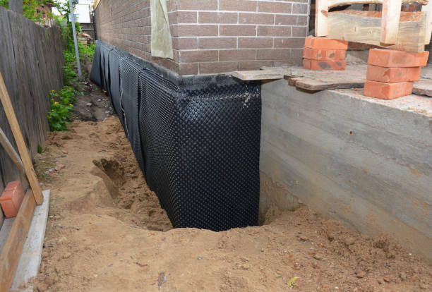 SJ Waterproofing Pros technician performing targeted Exterior Waterproofing assessment in Hamlet, IN